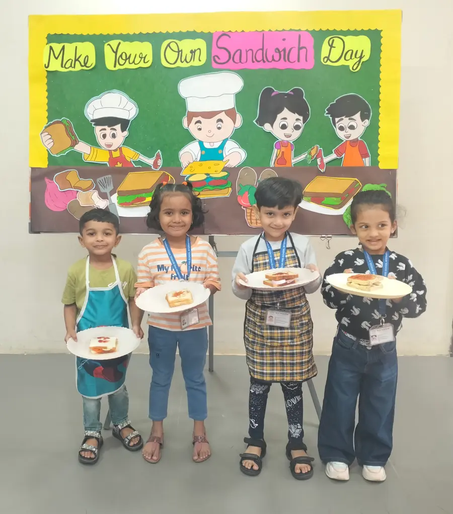Children making sandwiches during a Rainbow nursery school activity