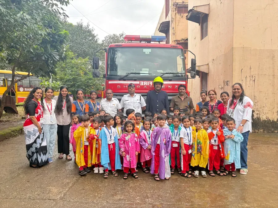 Preschool children and teachers visiting a fire engine