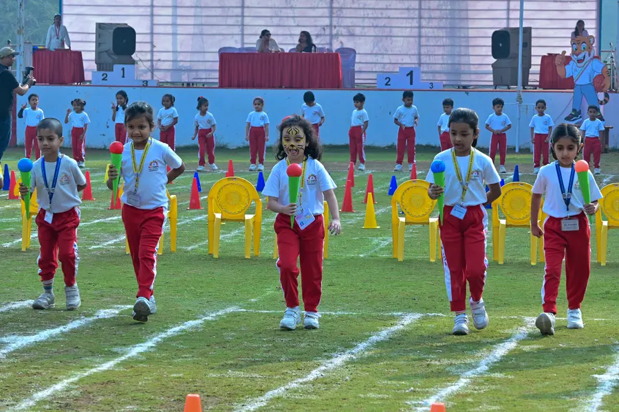 Children enjoying outdoor games during preschool sports day