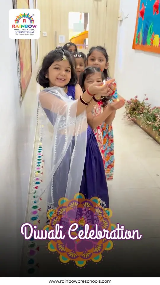 Children in festive clothing stand beside colourful floor decorations