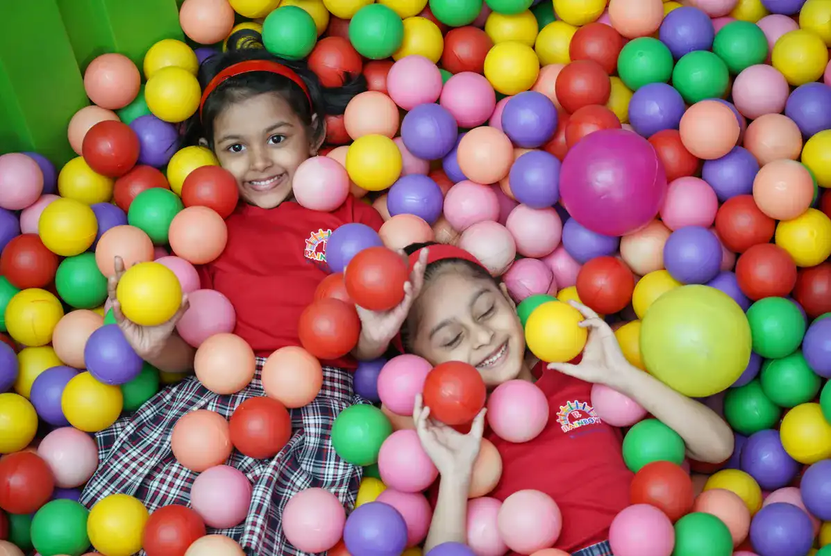 Children engaged in structured classroom activity at Rainbow Preschool Thane