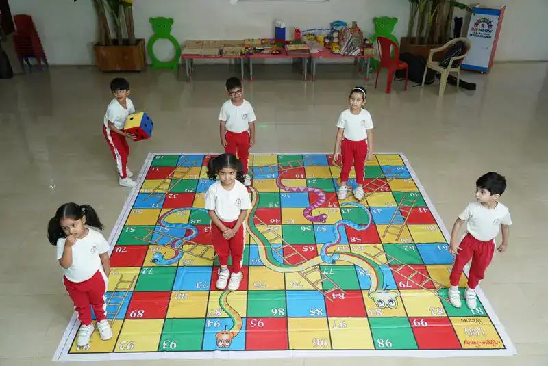 Nursery children building with blocks to develop motor skills